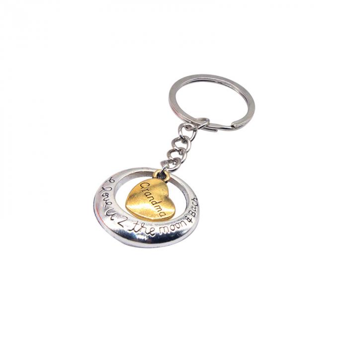 la aduana vende al por mayor el nuevo metal precioso creativo de la aleación del cinc del regalo del coche de la forma del corazón keychian